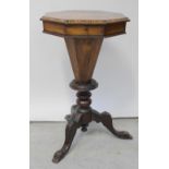 A 19th century walnut inlaid sewing table with interior fabric covered sections to octagonal column