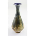 Royal Doulton; a Doulton Lambeth blue, green and amber drip glaze baluster vase,