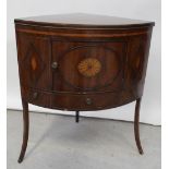 A George III mahogany marquetry corner wash stand with central fan paterae to the door over three