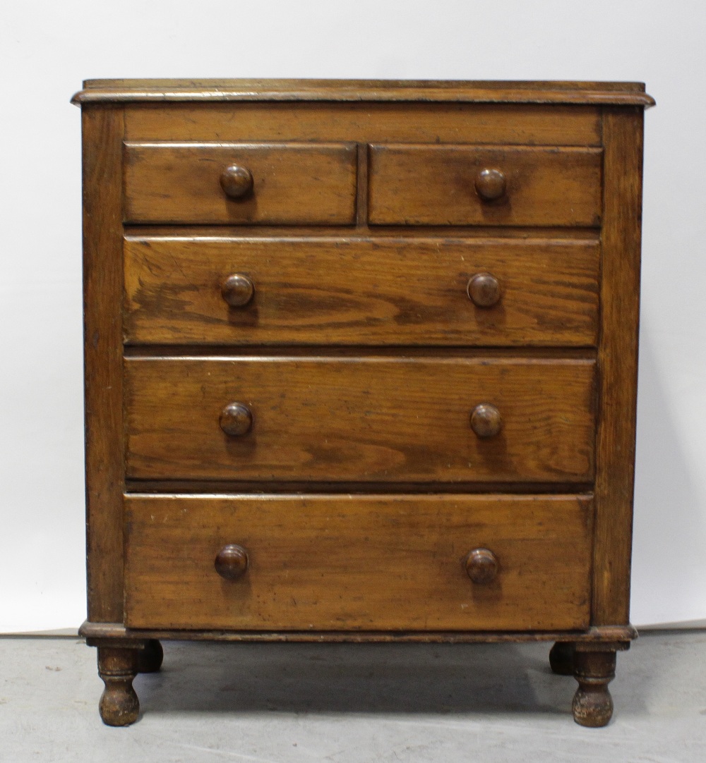 A Victorian scumble pine chest of two-over-three drawers, on turned legs, height 105cm.
