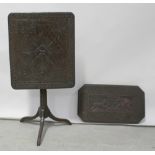 A 19th century oak rectangular tilt-top table with abstract floral and scroll decoration,