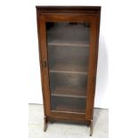 An early 20th century mahogany glass-fronted bookcase with drop handle, height 112cm.