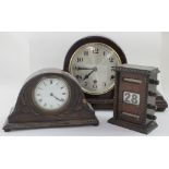 A 1930s mahogany Napoleon hat style mantel clock, the silvered dial set with Arabic numerals,