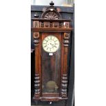 A late 19th century mahogany-cased Vienna-style eight-day wall clock,