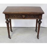 A 19th century oak Gothic-style foldover games table,