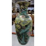 A 19th century Chinese famille jaune baluster vase decorated in enamels with birds and flora to