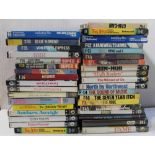 A collection of Super 8 movies in cardboard and plastic containers to include 'The Sound of Music',
