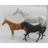 A large dapple grey Beswick stallion, height 29cm,