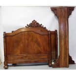 An early 20th century flame mahogany bateau lit double bed frame,