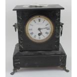 A black slate and marble mantel clock, the white enamel dial set with Roman numerals,