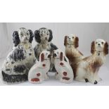 Three graduated pairs of reproduction Staffordshire chimney dogs,