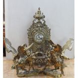A late Victorian brass mantel clock,