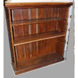 An early 19th century oak freestanding bookcase, two shelves to plinth support,