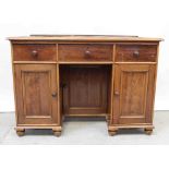 A Victorian mahogany kneehole desk with three frieze drawers,