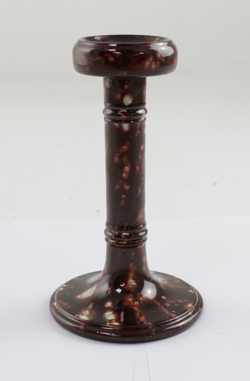 A 19th century Salopian sponge glazed candlestick,