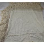 A large ivory-coloured hand-embroidered square silk shawl with reticulated edge, approx 165 x 165cm.