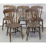 A Victorian pine kitchen table to turned supports and castors,