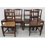 A harlequin set of six solid seat kitchen chairs comprising five oak and one walnut example with