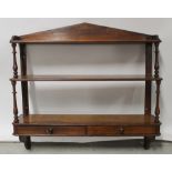 A 19th century Douglas Fir wall-mounted shelving rack, the lower shelf with two frieze drawers,