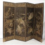 A Japanned four-fold dressing screen with gold thread Japanese embroidery panels depicting birds in