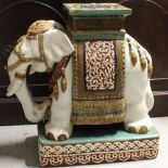 A ceramic Oriental style garden seat in the form of an elephant, height 56.5cm.