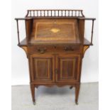 An Edward VII mahogany bureau with bobbin turned galleried back and shell paterae inlaid fall front,