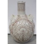 A large cream ground pottery ovoid twin-handled vase with foliate and floral sgraffito decoration,