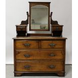 A late Victorian golden oak dressing chest of two-over-three drawers,