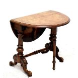 A Victorian walnut and inlaid Sutherland table, height 48cm, length 44cm, width when extended 64cm.