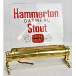 A vintage 'Watney's Hammerton Oatmeal Stout' bar advertising sign, the brass base inscribed '