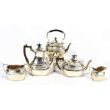 EDWARD BARNARD & SONS LTD; a George V hallmarked silver five piece tea service comprising spirit