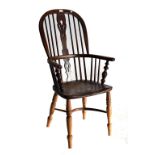 An ash and elm high hoop back Windsor chair with pierced splat and crinoline stretcher.