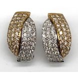 An 18ct yellow and white gold diamond set earrings, each set with sixty diamonds, approx 7.6g.