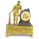 A 19th century brass and bronzed mantel clock, modelled as Hercules beside the drum type movement,