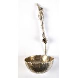 SADAJIRO MUSASHIYA; a Victorian hallmarked silver sifting spoon with bamboo type handle and floral