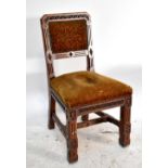ATTRIBUTED TO AUGUSTUS WELBY NORTHMORE PUGIN; an unusual Victorian Gothic carved oak dining chair