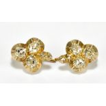 A pair of yellow metal and diamond set trefoil earrings, head length approx 12mm, approx 3.5g.