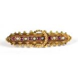 A 15ct yellow gold seed pearl decorated brooch, length 4cm, approx 3.4g.