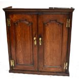 An 18th century oak twin door cupboard, height 82cm.Additional Information75.5 x 75 x 26cm.