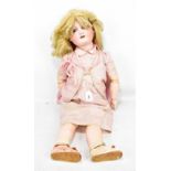 ARMAND MARSEILLE; an early 20th century German bisque porcelain headed doll with blonde wig, open/