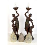 A pair of circa 1900 spelter figural lamps, with flaming torch frosted glass shades, height 73cm,