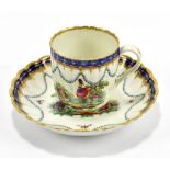 WORCESTER; an 18th century first period coffee cup and saucer decorated with exotic birds within