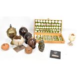 A group of coconuts with hinged lids including brass mounted example, cased display of shells,