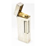 DUNHILL; a rare cased silver and wood grain effect rectangular Rollagas lighter, the base stamped '