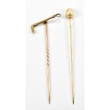 Two gold tie pins, a 15ct gold with riding crop top, the other 9ct with small freshwater pearl