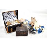 A group of early 20th century doll's clothing and accessories including hat, trunk containing