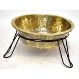 A large brass bowl, with associated stand, diameter 82cm.