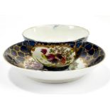 WORCESTER; an 18th century first period tea bowl and saucer, with cracked ice ground and panels