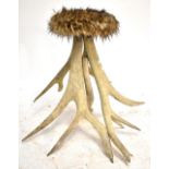 A stool made from antlers, height 79cm.