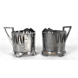 WMF; a pair of silver plated Art Nouveau glass holders with oxydised finish, both with factory marks